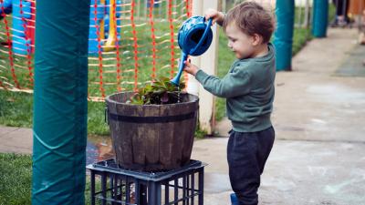 Kid with watering can